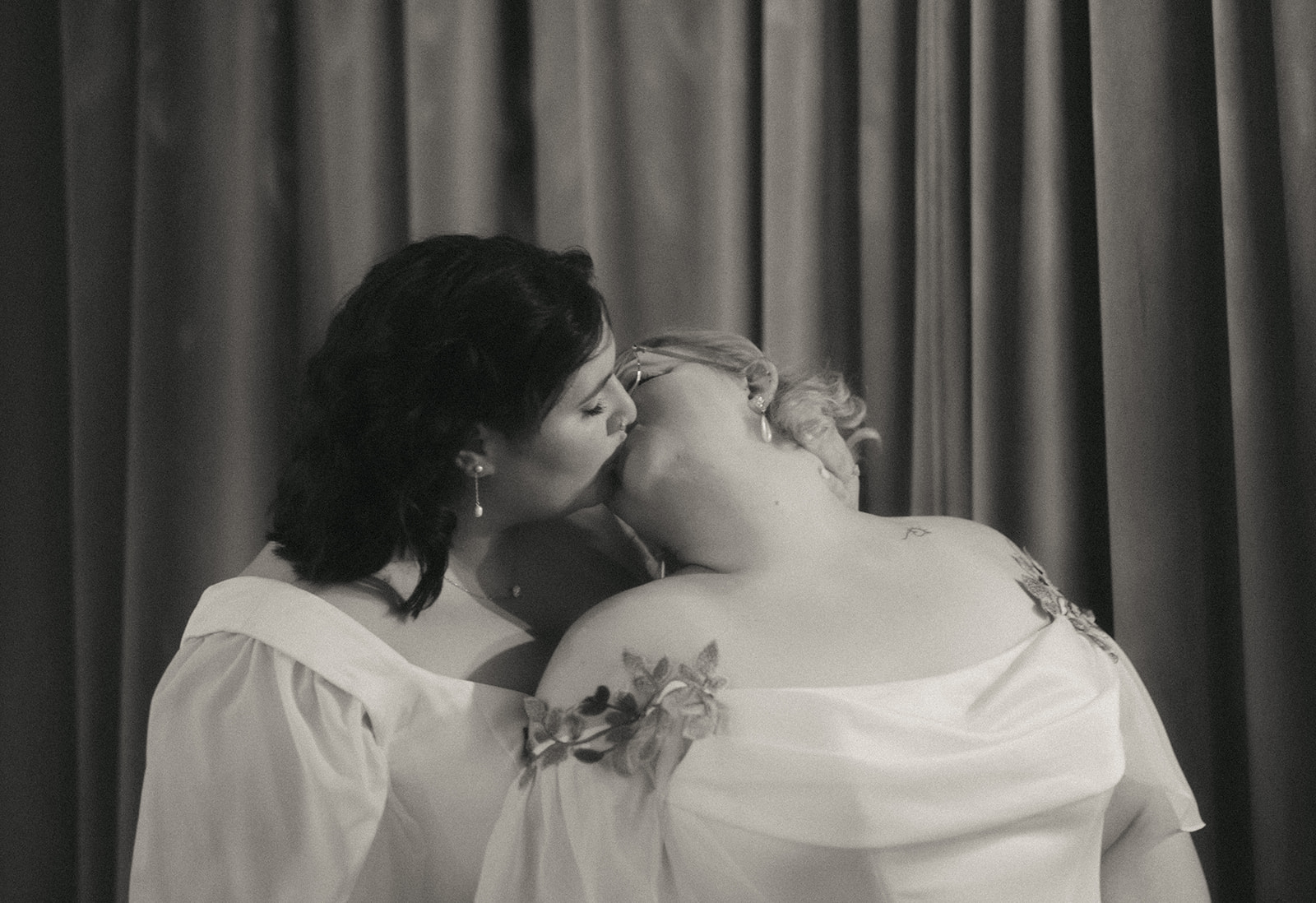 Queer couple kissing in Dearly Studio - one of the best nontraditional wedding venues in the Boston area! Photo by Rhode Tripper Photography