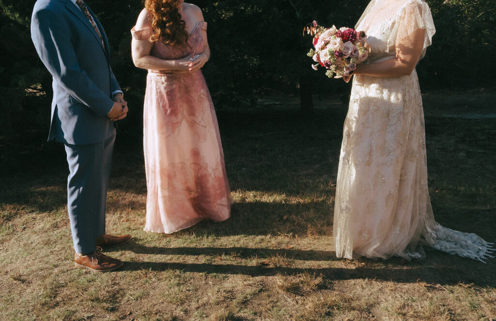 Artistic photo with heads cropped out to show the bride, her mom and her brother's outfits for the wedding. Photo by Rhode Tripper Photography