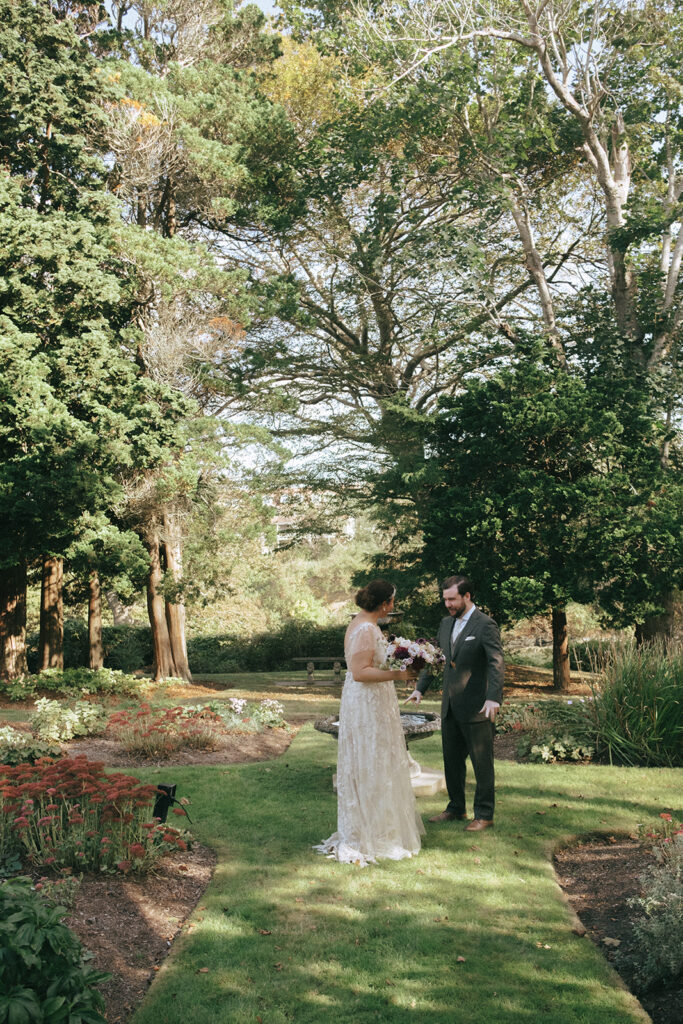 Bride and groom having their first look in the center of the gardens at Castle Hill Inn. Photo by Rhode Tripper Photography