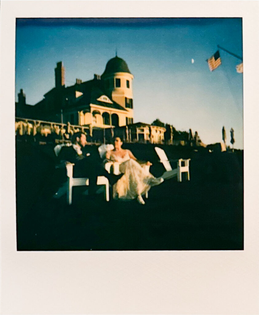 Polaroid scan of bride and groom seated in Adirondack chairs on the Castle Hill Inn lawn. Photo by Rhode Tripper Photography