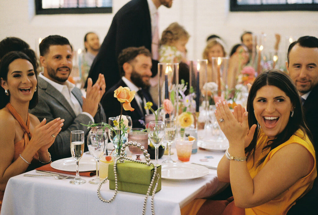 Candid moments of guests enjoying spring wedding at boutique hotel venue. Photo by Rhode Tripper Photography