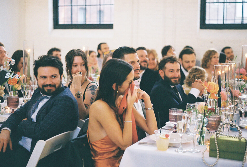 Guests tearing up over heartfelt speeches at Providence spring wedding. Photo by Rhode Tripper Photography