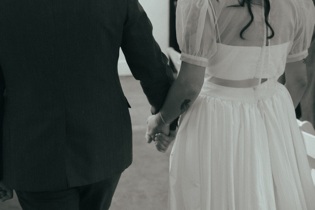 Newlyweds leaving wedding ceremony in Providence. Photo by Rhode Tripper Photography