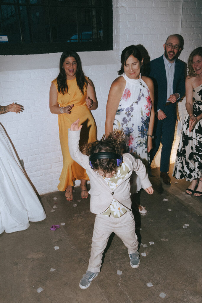 Nephew tearing up the dance floor at a spring hotel wedding. Photo by Rhode Tripper Photography