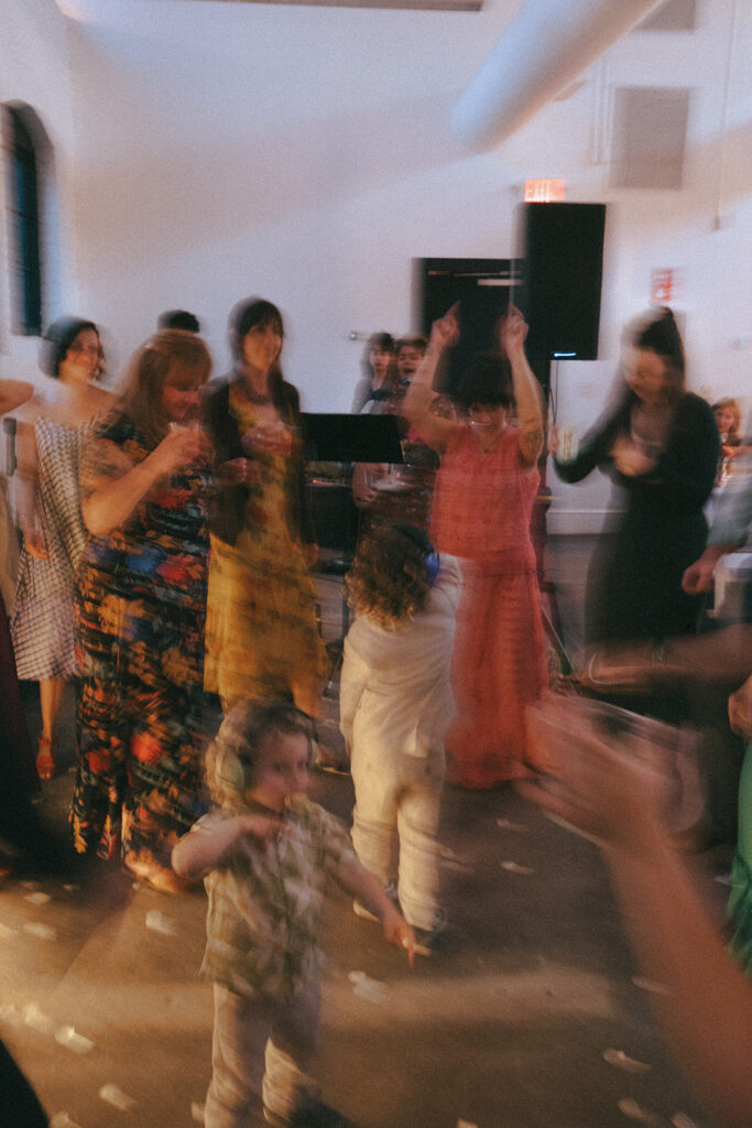 Packed dance floor with live band at spring wedding reception in Providence. Photo by Rhode Tripper Photography