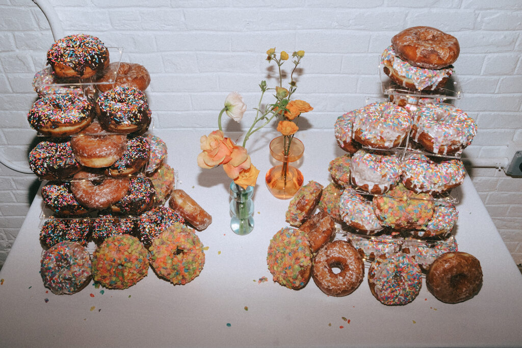 Donut dessert display at spring wedding reception at boutique hotel. Photo by Rhode Tripper Photography