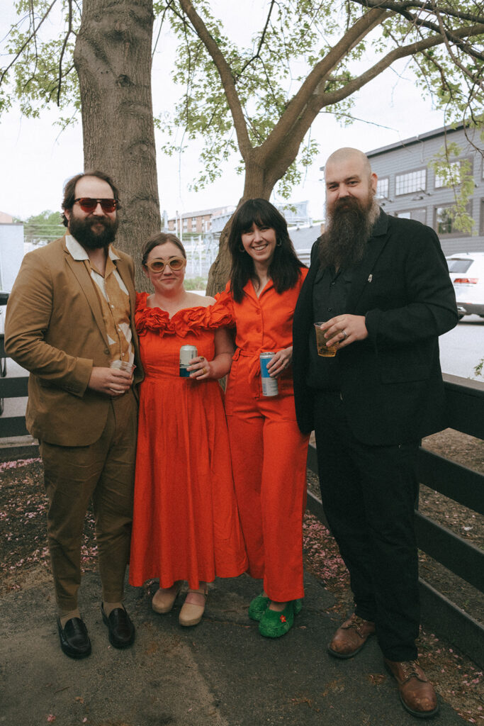 Guests in retro-inspired colorful clothing at spring wedding. Photo by Rhode Tripper Photography