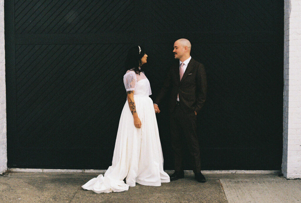 Bride and groom in on film at wedding. Photo by Rhode Tripper Photography