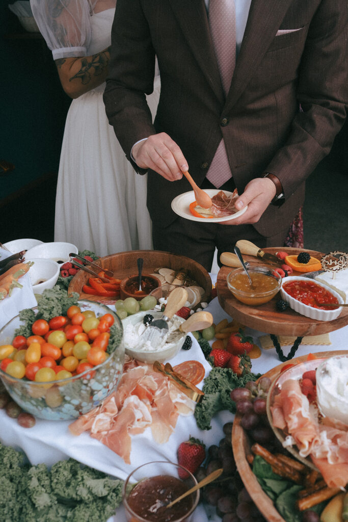 Casual charcuterie grazing table with guests serving themselves thanks to a laid-back wedding timeline.