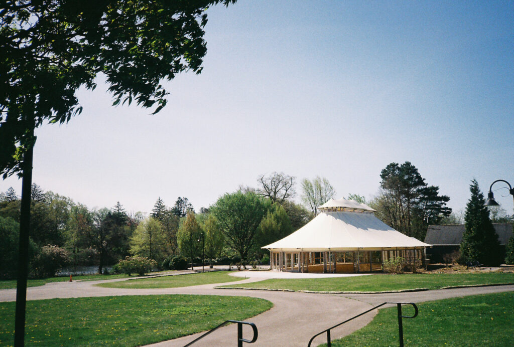 Lakeside Pavilion tented wedding reception space at the Roger Williams Park Botanical Center.