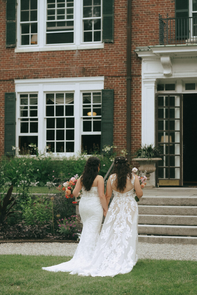 Brides walking down the aisle back into the mansion at Bradley Estate.