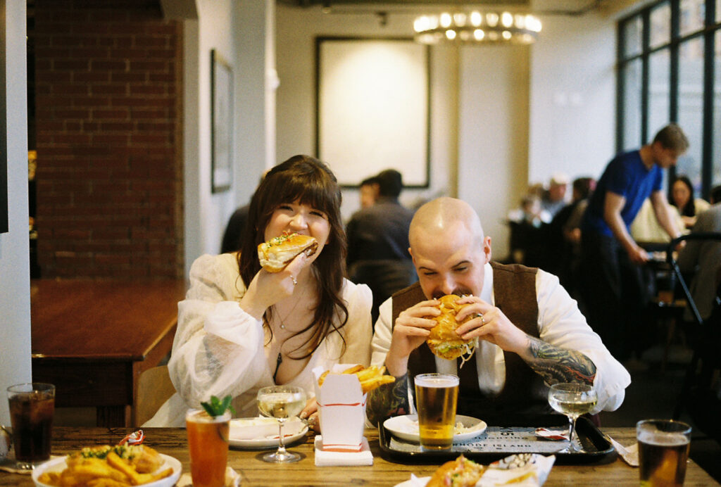 couple eating seafood on their wedding day at a restaurant in Providence